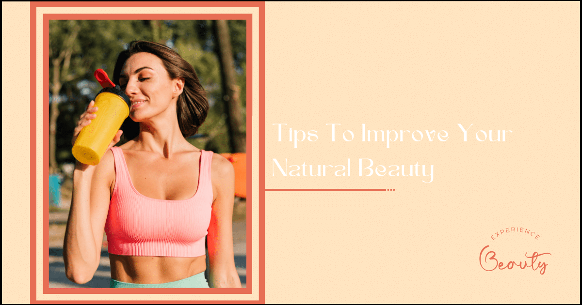 Tips To Improve Your Natural Beauty Banner Image - Sporty woman in fitting sport wear at sunset at outdoor sports ground positive posing enjoying summer weather in park holding protein shaker